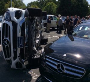 From Chris Murphy 01634 686 515 Sorry ladies. A woman taking out a posh new Mercedes for a test drive took just six seconds to crash it in to several cars and flip it on its side  all while still in the dealerships car park. Police in Virginia were called to the Balston forecourt, and found amazingly, no one was hurt. Local news site arlnow reports the incident happened at the Mercedes dealership on North Glebe Road. They said: Were told that the driver was just beginning a test drive, in the dealership parking lot, and might have mistaken the gas pedal for the brake. She crashed into four vehicles before the SUV rolled onto its side. Four people who were in the SUV at the time managed to get out before police and firefighters arrived, were told. One dealership worker was evaluated by medics for a possible back injury. No one was seriously hurt. Ends