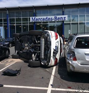 From Chris Murphy 01634 686 515 Sorry ladies. A woman taking out a posh new Mercedes for a test drive took just six seconds to crash it in to several cars and flip it on its side  all while still in the dealerships car park. Police in Virginia were called to the Balston forecourt, and found amazingly, no one was hurt. Local news site arlnow reports the incident happened at the Mercedes dealership on North Glebe Road. They said: Were told that the driver was just beginning a test drive, in the dealership parking lot, and might have mistaken the gas pedal for the brake. She crashed into four vehicles before the SUV rolled onto its side. Four people who were in the SUV at the time managed to get out before police and firefighters arrived, were told. One dealership worker was evaluated by medics for a possible back injury. No one was seriously hurt. Ends