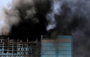Smoke rises after a fire broke out in a building  in Abu Dhabi, UAE, August 30, 2016. REUTERS/Stringer