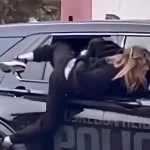 Info Shqip: Arratisje e pazakontë në SHBA, gruaja me pranga në duar del nga dritarja e makinës së policisë! Ia mbath me vrap